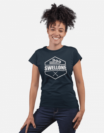 Woman standing and wearing a navy Swellone tshirt.