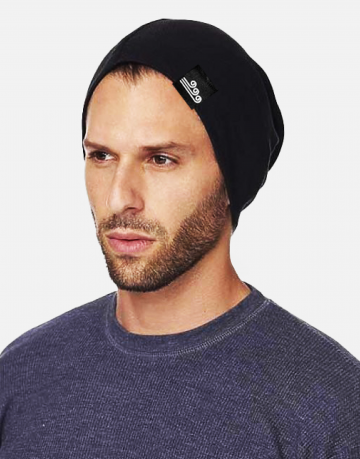 Man wearing a black eco beanie with Swellone logo.