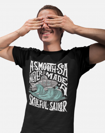 Man standing, covering his eyes, and wearing a black Swellone tshirt.