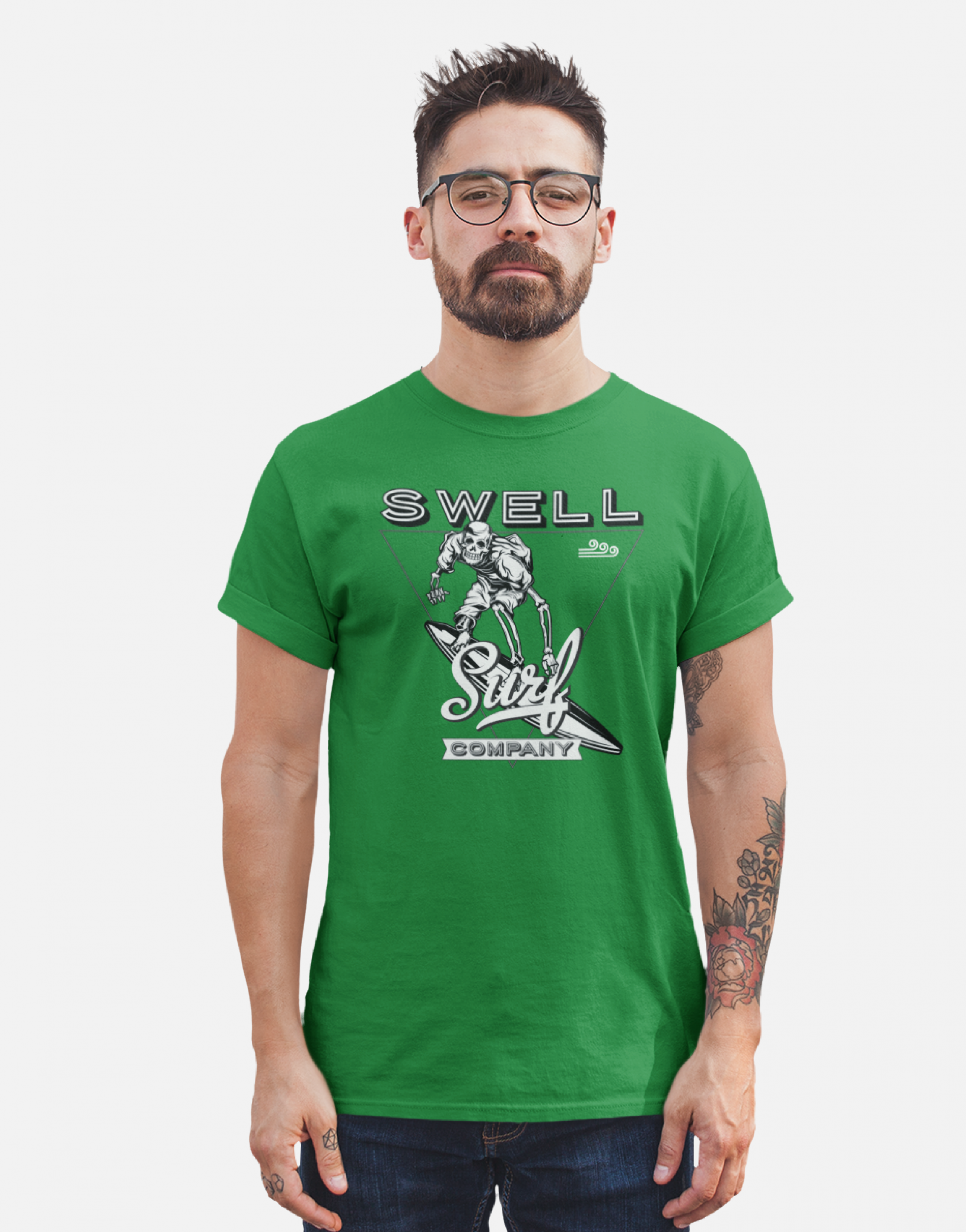 Man wearing a kelly green Swellone tshirt with Skelton surf logo.